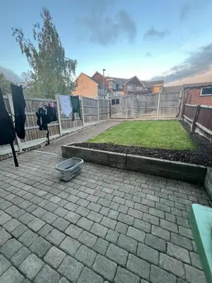 a backyard with a fence and a dog bowl on a patio at 3 Bed Home, Sleeps 7 with Garden in Basildon in Basildon