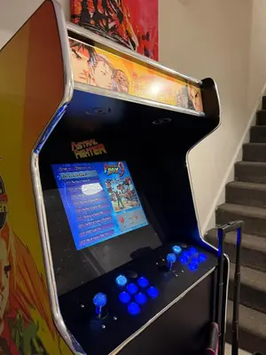 a pinball machine with blue dominoes on it at 3 Bed Home, Sleeps 7 with Garden in Basildon in Basildon