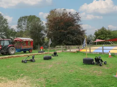 a group of four wheeled vehicles parked in a field at Duke Cottage in Woodbridge