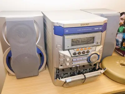 a computer system sitting on a table with speakers at Hayloft in Ipswich