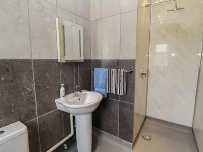 a bathroom with a sink and a shower at Fisherman's Rest in Ipswich