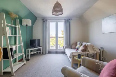 a living room with a couch and a window at 1Bed Central Apt With Parking in Chesterton