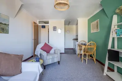 a living room with a couch and a table at 1Bed Central Apt With Parking in Chesterton