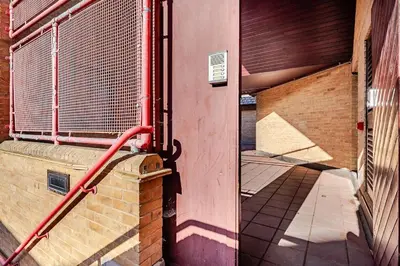 an entrance to a building with a metal fence at Chic escape in Cambridge