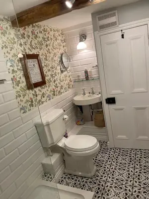 a bathroom with a toilet and a sink at The Old Scullery in Bungay