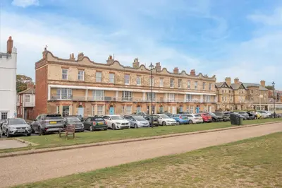 a large building with cars parked in front of it at 11b Market Cross Place, Aldeburgh in Aldeburgh