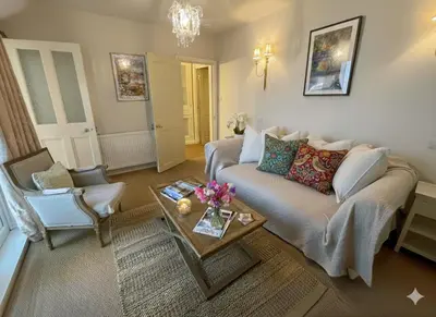 a living room with a couch and a table at Luxury boutique 'Duke Suite' In historic centre in Cambridge