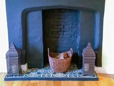 a basket sitting in front of a fireplace at Guest Rooms at The Green Man in Takeley