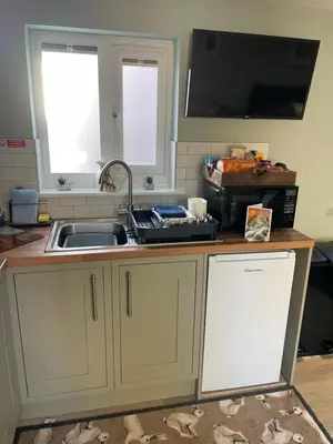 a kitchen with a sink and a counter top at Woodland View in East Harling