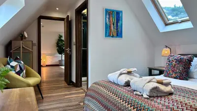 a bedroom with a bed with a stuffed animal on it at Luxury Retreat with Spa Access - Sleeps 6 in Peldon