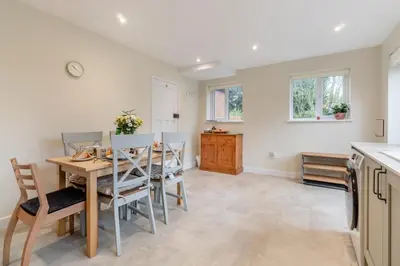 a kitchen and dining room with a table and chairs at 2 Bed in Knodishall oc-s33543 in Friston
