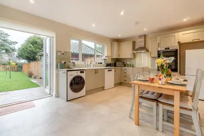 a kitchen with a table and a sink and a stove at 2 Bed in Knodishall oc-s33543 in Friston