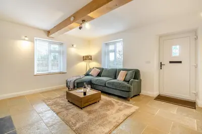 a living room with a couch and a table at 2 Bed in Fincham oc-t33561 in Fincham