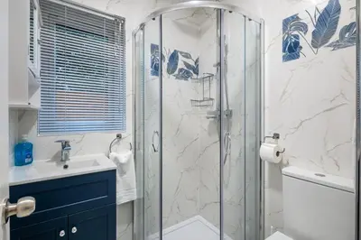 a bathroom with a shower and a sink at Newly refurbed 3Bed Annexe - With Parking! in Albury