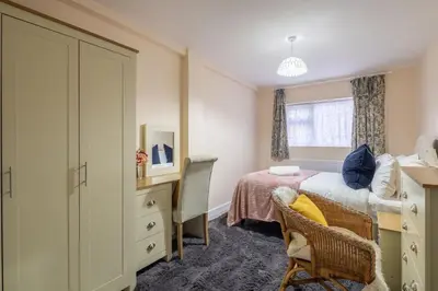 a small bedroom with a bed and a desk at Newly refurbed 3Bed Annexe - With Parking! in Albury