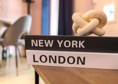 a new york london sign with two bananas on a table at Stylish central location 3 bedroom house in Ely