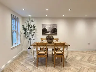a dining room with a table and chairs at 4 bed Townhouse in Central Bury St Edmunds in Bury Saint Edmunds
