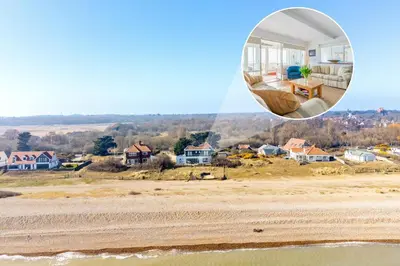 a view of a house from the beach at Chicoutimi 4 in Thorpeness
