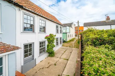 a row of white houses in a street at Sanderlings 4 in Aldeburgh