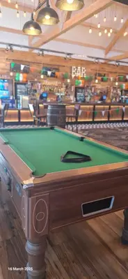 a pool table in a room with a bar at Heavenly Huts GC056 in Saint Osyth