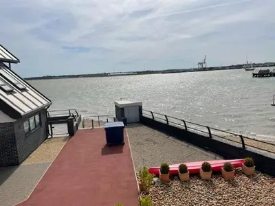 a house with a view of a body of water at Admirals in Shotley Gate