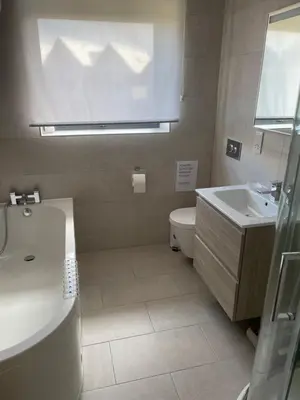 a bathroom with a sink and a toilet at Ten Admiralty Pier in Shotley Gate