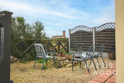 a group of chairs sitting in front of a fence at Harvest Close, Marks Tey in Marks Tey