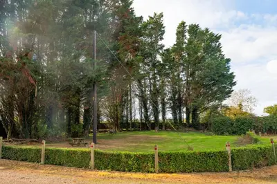 a park with a golf ball in the grass at 3 Bed Country House with Pool and Sauna in Tibenham