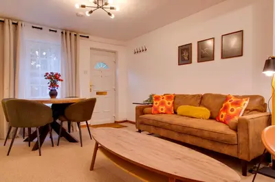 a living room with a couch and a table at Stylish Victorian Terrace in Central Cambridge Pass the Keys in Cambridge