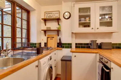 a kitchen with a sink and a dishwasher at Stylish Victorian Terrace in Central Cambridge Pass the Keys in Cambridge