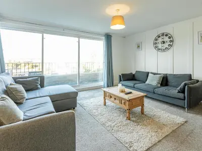 a living room with two couches and a coffee table at Pass the Keys Large 4 Bedroom Home Stunning views Contractor in Basildon