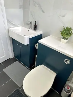 a bathroom with a white toilet and a sink at Ama comfort Stay in Hythe