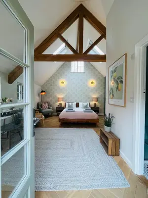 a bedroom with a bed and a large window at Luxury Designer Boutique Annexe - Walk to Award Winning Pub in Sibton