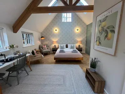 a bedroom with a bed and a living room at Luxury Designer Boutique Annexe - Walk to Award Winning Pub in Sibton