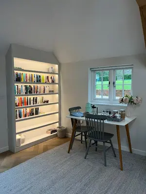 a dining room with a table and chairs and a book shelf at Luxury Designer Boutique Annexe - Walk to Award Winning Pub in Sibton