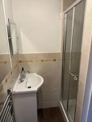 a bathroom with a sink and a shower at Cosy two bedroom house in eye Suffolk with parking near A140 in Eye