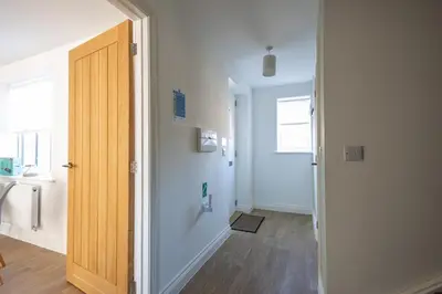 a hallway with a door leading to a bathroom at The Nook - Sizewell - Contractor Accommodation in Aldringham