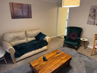 a living room with a couch and a coffee table at The Wright Place To stay in East Harling