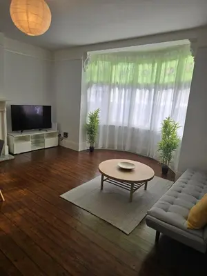 a living room with a couch and a coffee table at Coastal Comfort in Leigh Ideal for Work & Leisure in Southend-on-Sea