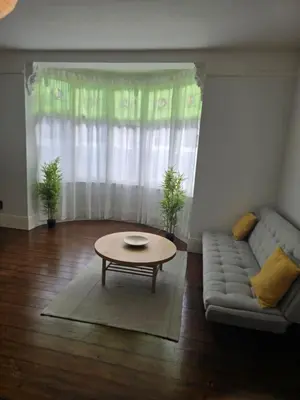 a living room with a couch and a coffee table at Coastal Comfort in Leigh Ideal for Work & Leisure in Southend-on-Sea