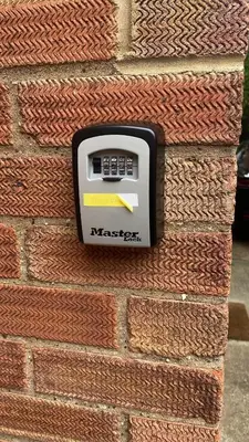 a meter on a brick wall with a yellow arrow at Charming Cambridge Studio with Private Garden in Cherry Hinton