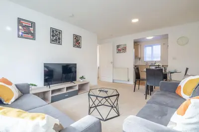 a living room with two couches and a tv at Spacious 2BR I 2BA I Sleeps 4 I Near Science Park in Milton