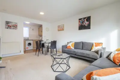 a living room with a couch and a table at Spacious 2BR I 2BA I Sleeps 4 I Near Science Park in Milton
