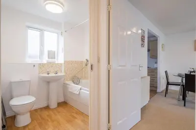 a bathroom with a toilet and a sink and a tub at Spacious 2BR I 2BA I Sleeps 4 I Near Science Park in Milton