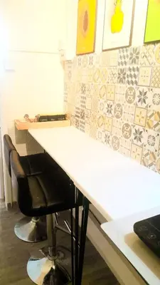 a white counter with a black chair at a desk at Home stay central in Cambridge