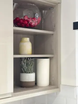 a cupboard with some food and a plant in it at Easy walk to Addenbrookes - Stylish 1 bedroom Apartment in CBG