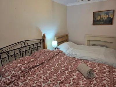 a bedroom with a bed with a pillow on it at Essex Colchester Cosy Room Zi in Hythe
