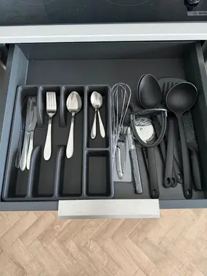 a drawer filled with utensils in a kitchen at Cosy one bedroom flat in the heart of Chelmsford in Chelmsford