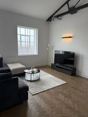 a living room with a couch and a coffee table at Cosy one bedroom flat in the heart of Chelmsford in Chelmsford