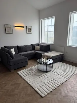 a living room with a couch and a coffee table at Cosy one bedroom flat in the heart of Chelmsford in Chelmsford